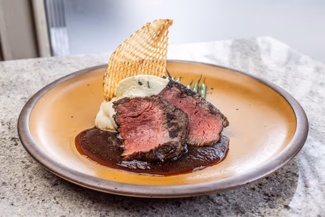Chestnut signature dishes Lobster Bisque, Lamb Moussaka, Mole Braised Short Ribs.